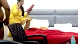 A young secretary receives a promotion from her boss in a hotel room