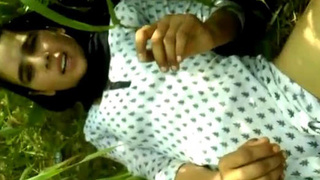 Indian woman engages in outdoor sex wearing traditional attire in a reed field