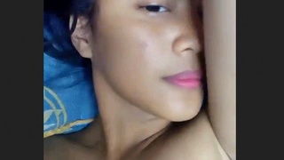 Aroused woman pleasures herself by fingering her butt and rubbing her vulva