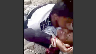 An Indian woman displays her breasts as she has sex