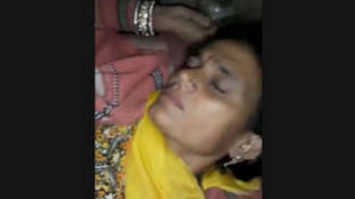 A mature woman from the village enjoys sexual intercourse with a man