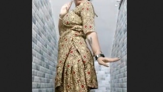 A curvy South Asian woman showcases her ample bosom