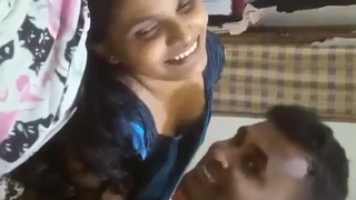 The loving couple enjoys each other's company in bed