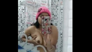 Indian girlfriends with large breasts revealed in reflection