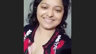 A married woman from Bangladesh with large breasts pleases her husband by posing for him