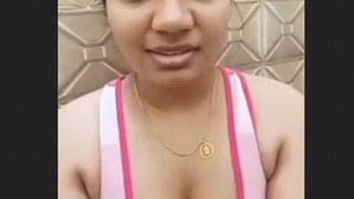 Indian aunty displays her breasts