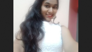 An Indian girlfriend displays her attractive physique for her partner while getting dressed