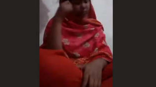 A girl from Bangladesh performs on a video chat