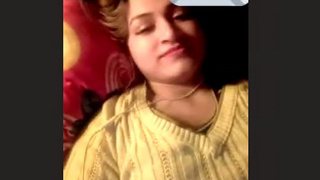 A stunning woman displays her breasts and genitals in a heated video chat