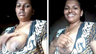 Aunty flaunts her large natural breasts to neighbors