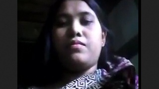 A stunning young woman displays her physique for the camera