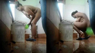 Indian girl with large breasts takes a steamy bath