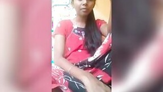 Unwary Desi lifts her sari slightly to expose her shaved pussy in a solo XXX show