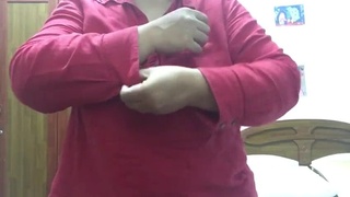 A mature woman undressing on camera