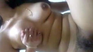 Desi girl vigorously stimulates her genitalia