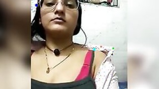 Desi slut in sexy glasses shows off her huge tits for a live webcam show