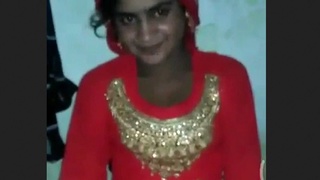 A charming village girl misbehaves in front of the camera