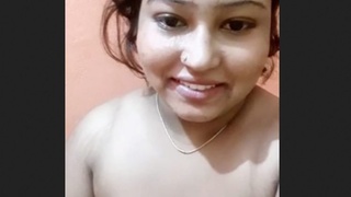 A seductive Bengali woman reveals her breasts and intimate area
