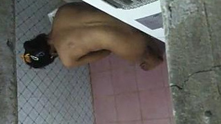 An Indian woman takes a bath