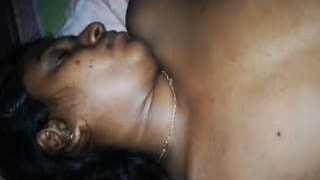 Husband wakes wife up and fondles her breasts while taking pictures