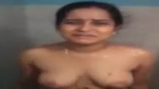 Desi bhabhi from South India undresses and washes herself