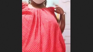 A young woman from Bangladesh flaunts her large breasts while dancing the tango