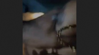 Jaya, the wife, reveals her breasts in a sensual display