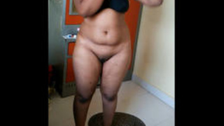 Busty girl in dress filmed revealing hairy pussy