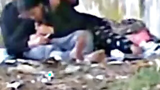 Sexy couple makes her suck it in a public park