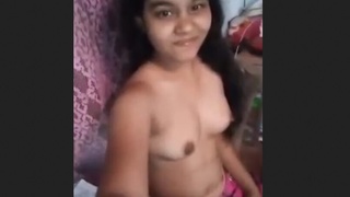 A charming Indian teen playfully pleases with her sensual display