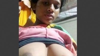 Indian village matron bares her breasts