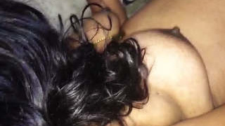 Husband indulges in fondling his wife's breasts