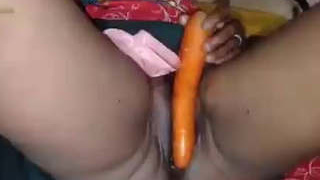 Indian wife pleasuring herself with a vegetable