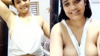 A seductive Indian woman displays her large breasts in a video labeled as bhabi.