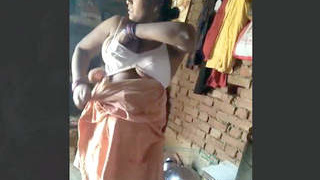 Indian wife dressed in village setting filmed by spouse