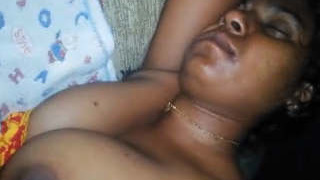 Husband awakens sleeping wife and touches her breasts